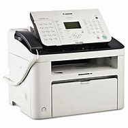 Photo of a fax machine. Faxing is available at a cost of $3 per 10 pages.