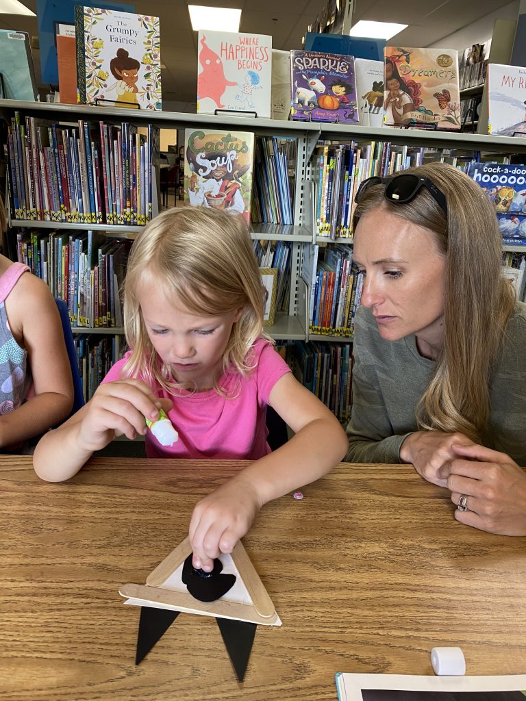 Photo of a mom and daughter crafting at Story Time at the Elizabeth Library.